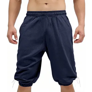 Detailed view of navy blue medieval viking shorts with leg ties on a male model