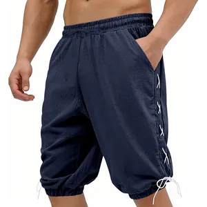 Detail of navy blue medieval Viking style shorts with white lace-up side details.