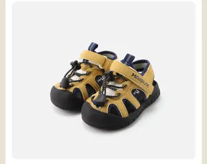 Detail view of yellow infant beach sandals with protective toe cap and velcro strap