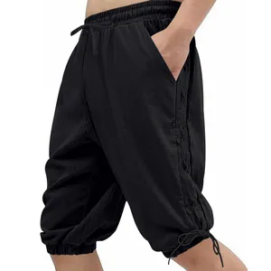 Detail view of men's medieval Viking black shorts with side lacing and drawstring