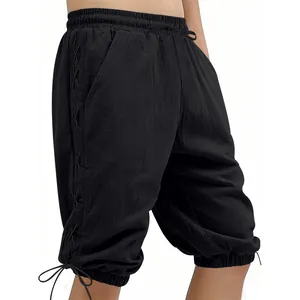 Detailed view of black medieval Viking style lace-up shorts showing side strapping