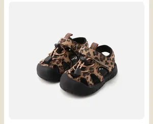 Close-up of leopard print infant walking shoes featuring durable non-slip soles