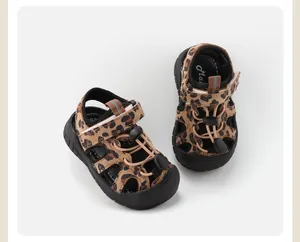 Close-up detail of leopard print baby sandals with breathable design and soft soles.