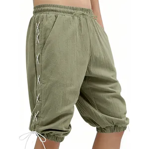 Close-up detail of men's vintage Viking style lace-up shorts in olive green fabric