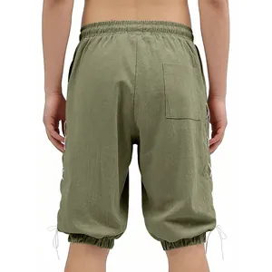 Back view of men's medieval Viking olive green shorts with side lacing details