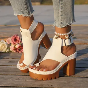 White leather platform sandals with chunky high heels and adjustable ankle strap
