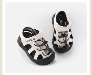 Detailed view of breathable white toddler outdoor sandals with non-slip black soles