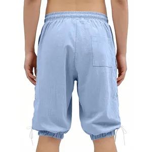 Back view detail of light blue medieval Viking style shorts with side lace-up design