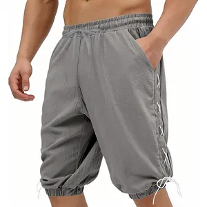 Close-up view of men's vintage Viking style grey casual shorts featuring side lace-up details