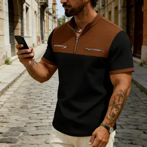 Close-up detail of men's waffle knit polo shirt with color block design and quarter zip