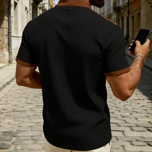 Back view of a men's stylish black checkered short sleeve shirt with brown contrast collar.