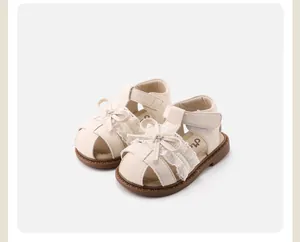 Elegant cream toddler sandals with sweet lace bow and hollowed-out closed-toe design