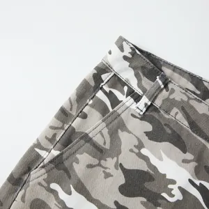 Macro detail of grey camouflage cargo shorts showing durable stitching and a belt loop area