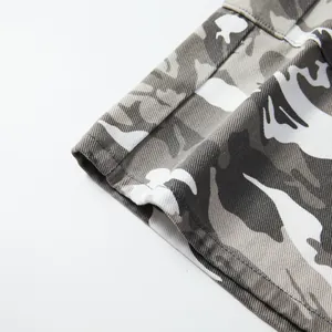 Close-up detail of the leg opening and twill fabric on men's camouflage cargo shorts