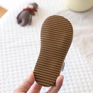 Close-up of non-slip rubber outsole for toddler girls' summer sandals with ridged texture.
