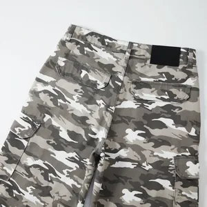 Close-up view of grey camouflage cargo pants showing back pockets and waist patch