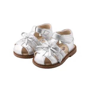Toddler girl silver closed-toe walking sandals with lace bow detail and soft sole