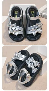 Detailed product shots of silver girls sandals featuring rhinestone bows and durable thick soles.