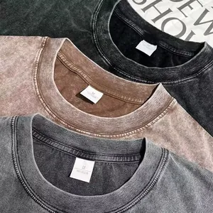 Close-up of three 240g heavy cotton snow washed vintage t-shirts showing collar detail