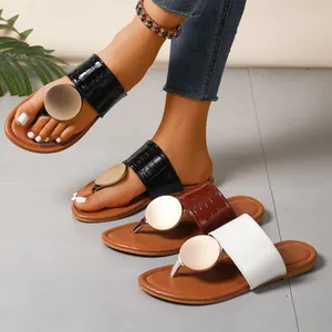 Women's casual low-heel thong sandals with metal disc and croc-embossed strap detail