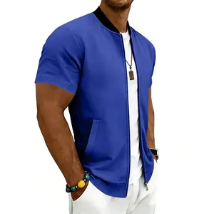 Detail view of men's blue short sleeve bomber jacket showing side profile and pocket.