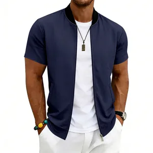 Detail of men's navy short sleeve bomber jacket with zip-up front and stand collar.