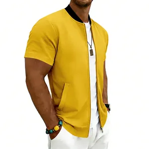 Close-up view of a yellow men's short sleeve bomber jacket with a black ribbed collar