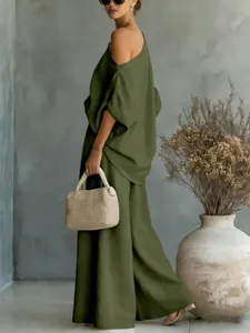 Side view of olive green loose two-piece set with off-shoulder top and wide-leg pants