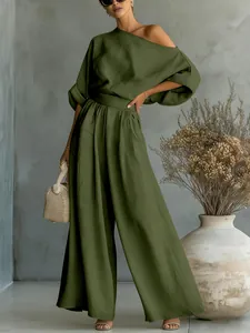 Elegant olive green two-piece set featuring off-shoulder top and wide-leg trousers