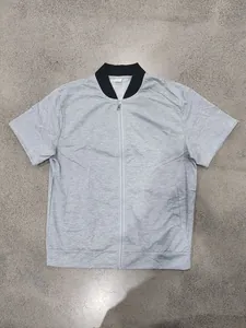 Detailed flat lay of a gray short-sleeved bomber jacket with black collar.