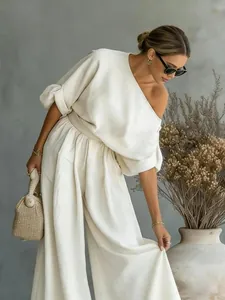 Elegant cream one-shoulder linen top and wide-leg pants set for women