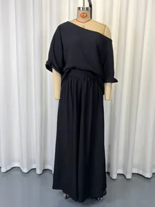 Women's black two-piece set featuring off-shoulder top and loose wide-leg pants