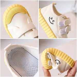 Breathable kids canvas shoes with soft yellow sole and velcro straps