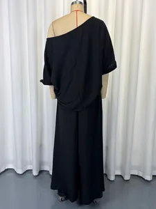 Back view of black two-piece set featuring off-shoulder top and wide-leg pants
