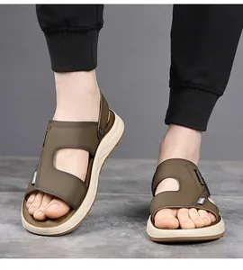 Detailed view of men's olive outdoor sandals featuring a soft beige sole on feet