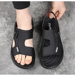 Detail view of black men's two-way sandals featuring soft soles and adjustable straps.