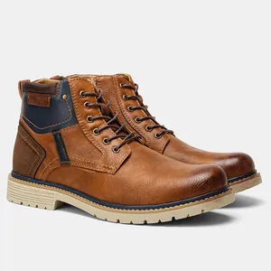 Detail of men's vintage brown leather ankle boots with navy accents and distressed toe