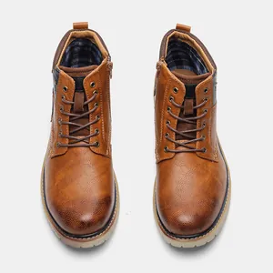 Top view of men's retro brown leather ankle boots with rubbed texture and side zipper