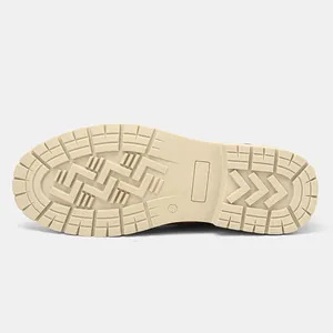 Macro view of the durable non-slip rubber lug sole on retro men's leather ankle boots