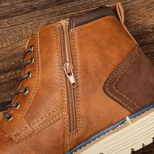 Detailed view of the side zipper and stitching on brown retro men's leather ankle boots