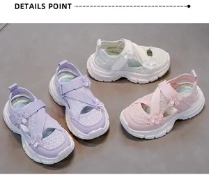 Detail view showing girls' floral mesh sports sandals in pink, white, and purple
