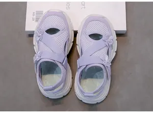 Top view of purple mesh sandals for girls with floral accents and soft white soles