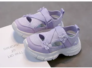 Detailed view of purple girls' breathable mesh sandals with floral accents and soft sole