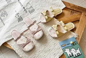 Girls' summer sandals with floral insoles and cute double bow details in pink and yellow