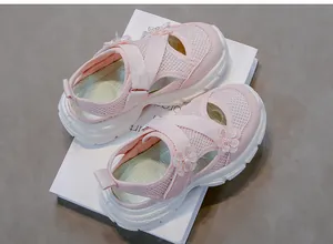Close-up of pink girls' breathable mesh sandals featuring decorative floral accents