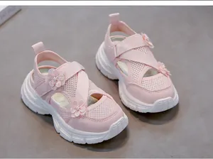 Stylish pink mesh girl's sandals featuring 3D floral ornaments and white soft soles