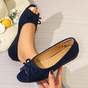 Elegant navy blue suede peep-toe flats with delicate bow accent for summer