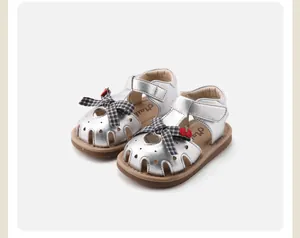 Silver baby girl soft sole closed-toe sandals with checkered bow and strawberry detail