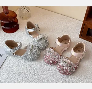Detailed view of girls' sparkling crystal princess shoes in silver and pink Mary Jane style