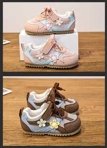 Detail view of breathable toddler girl sneakers with floral patches and Velcro straps